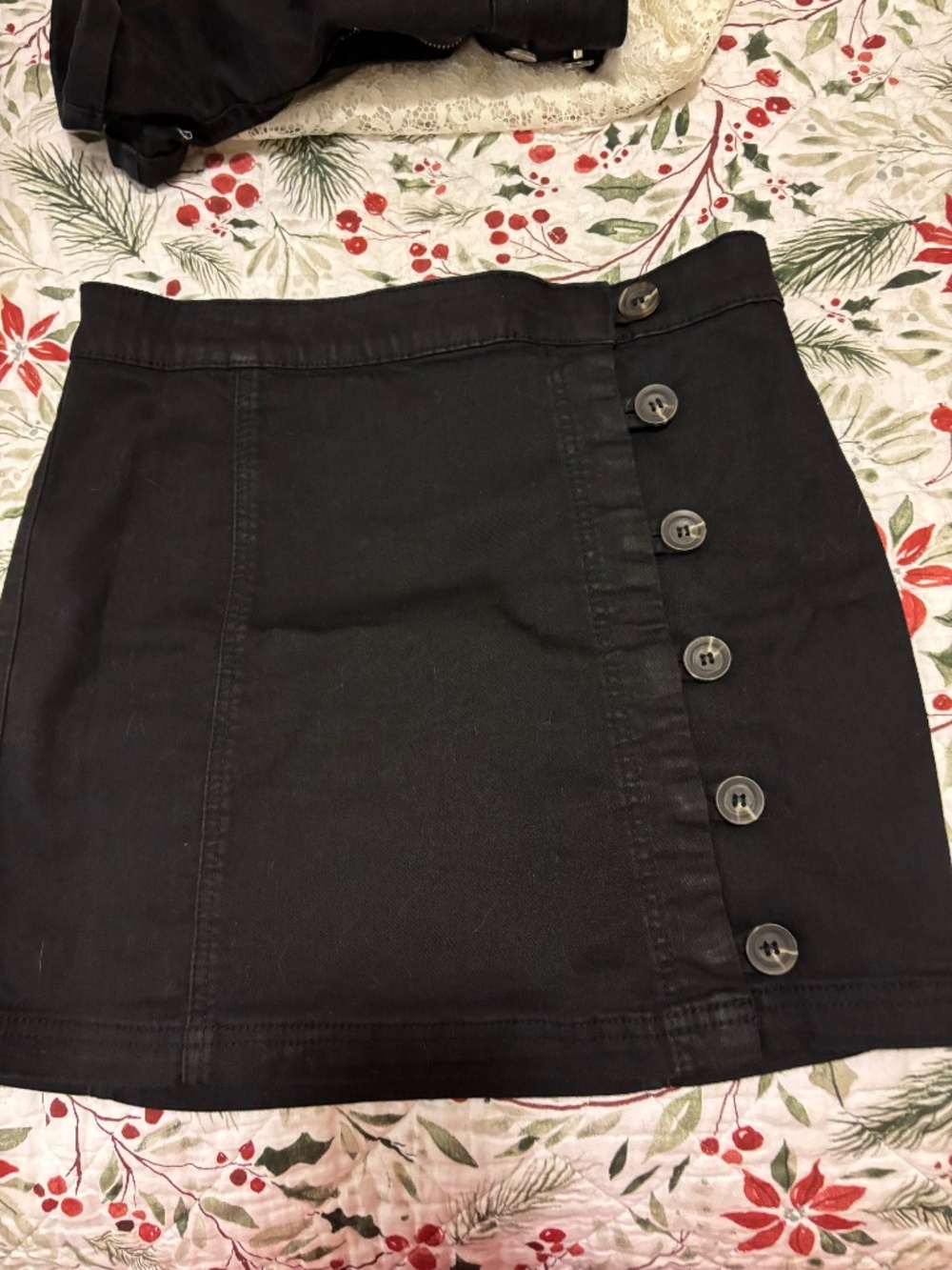 Black mini skirt with side buttons